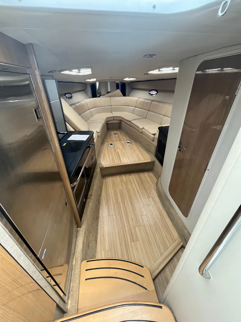 Slide: The Image of Interior of 2013 Formula 400 SS FX8 boat with modern wood finish and seating. - 30