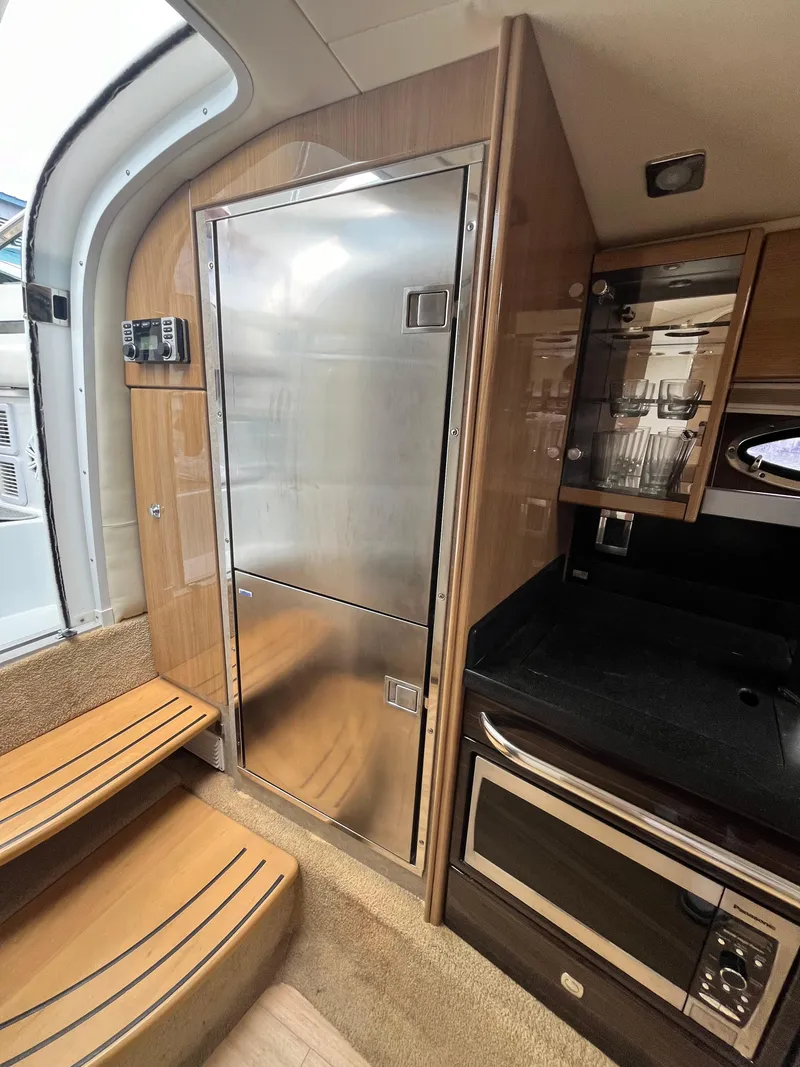 Slide: The Image of Interior of 2013 Formula 400 SS FX8 yacht, featuring modern kitchen amenities. - 31