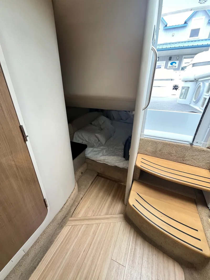 Slide: The Image of 2013 Formula 400 SS FX8 cabin interior with stairs and cozy sleeping area. - 32