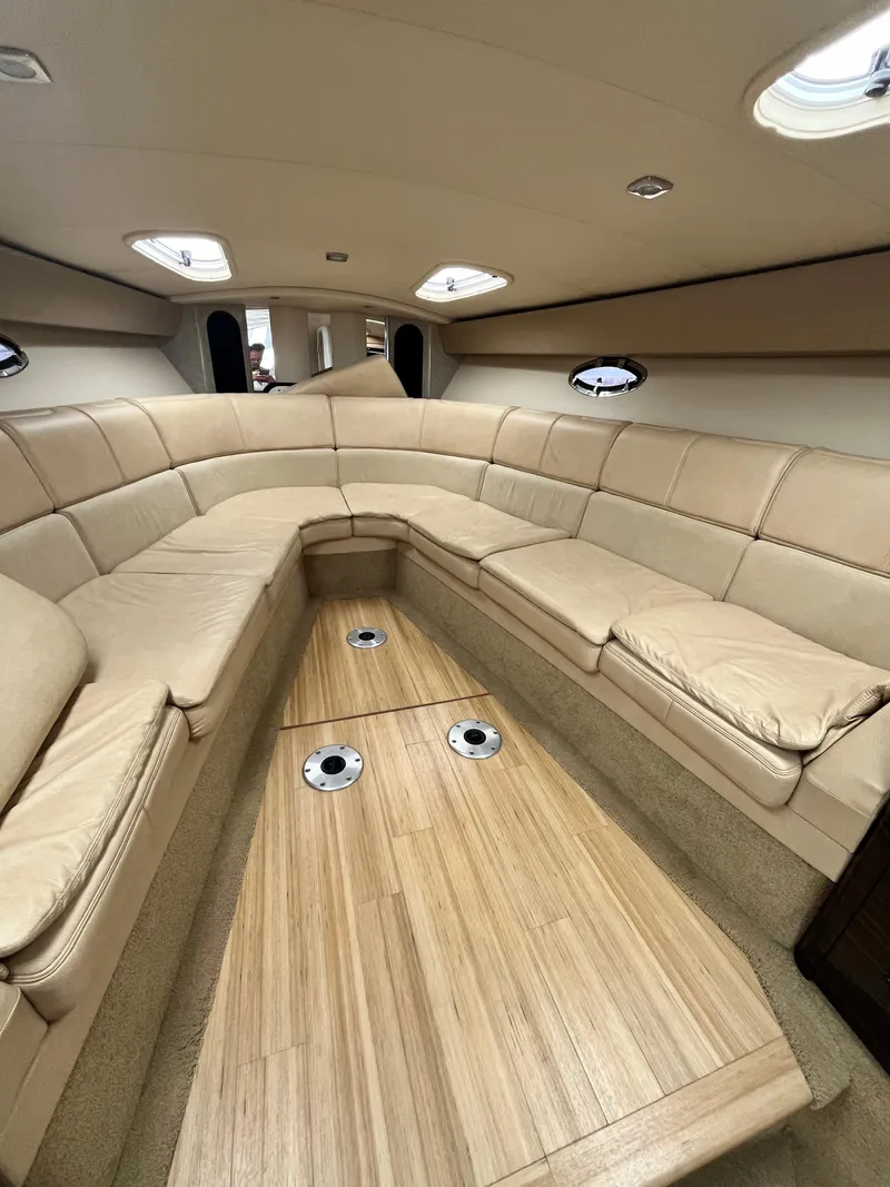 Slide: The Image of Luxurious interior of a 2013 Formula 400 SS FX8 boat with beige seating and wood flooring. - 33