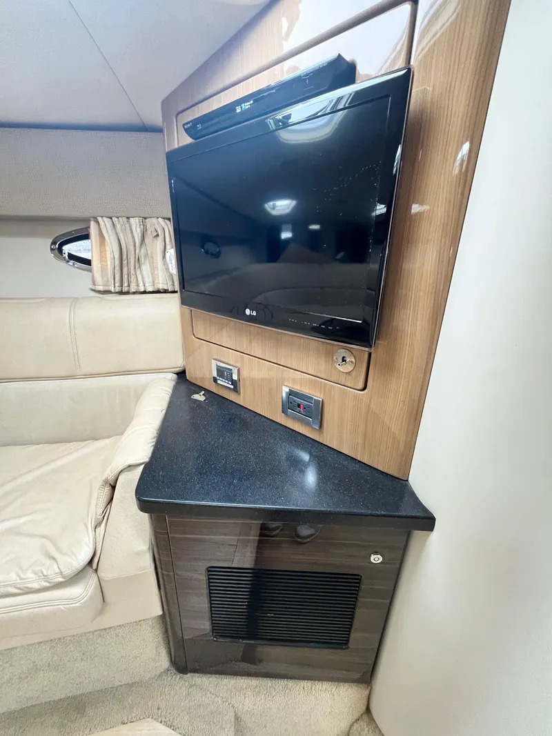 Slide: The Image of Interior of 2013 Formula 400 SS FX8 with TV and seating area. - 11