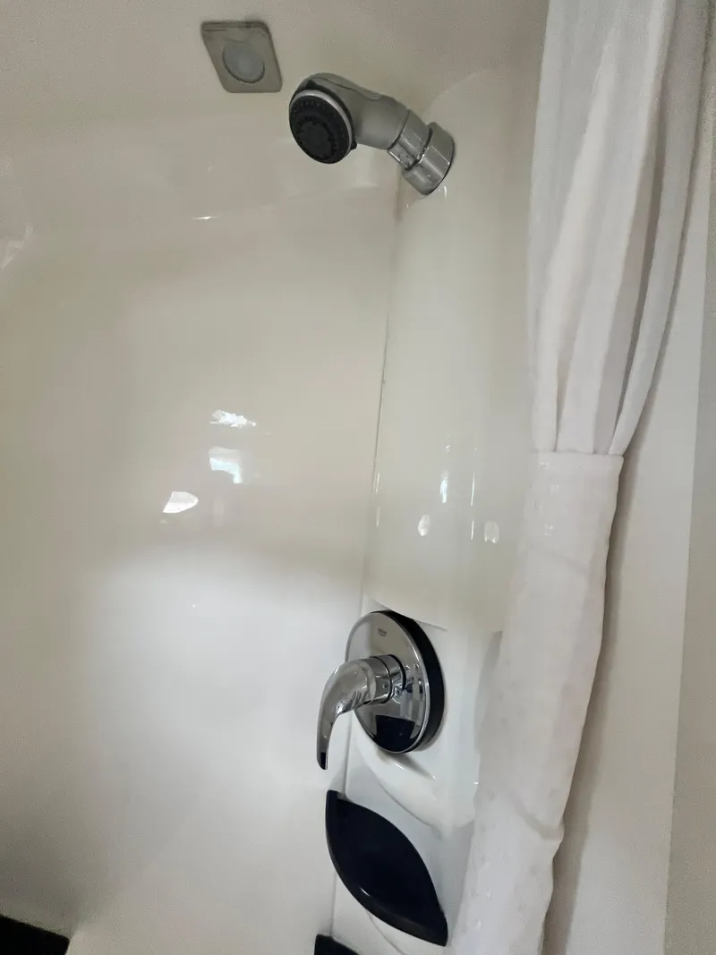 Slide: The Image of Shower area in a 2013 Formula 400 SS FX8 boat with white curtain. - 14