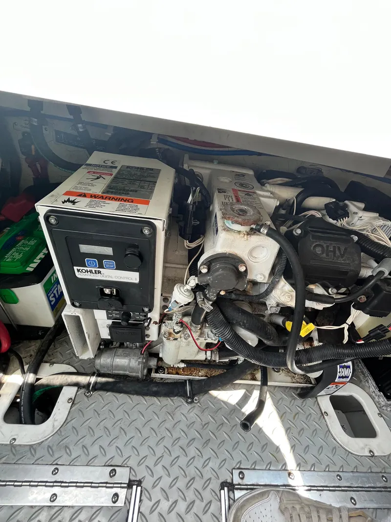 Slide: The Image of Engine compartment of a 2013 Formula 400 SS FX8 boat, featuring mechanical components. - 22