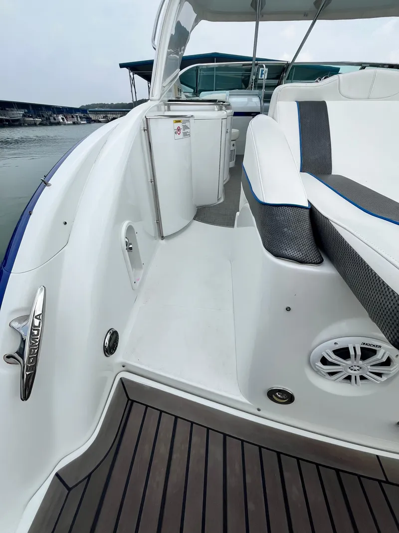 Slide: The Image of 2013 Formula 400 SS FX8 boat interior with sleek seating and modern design. - 24