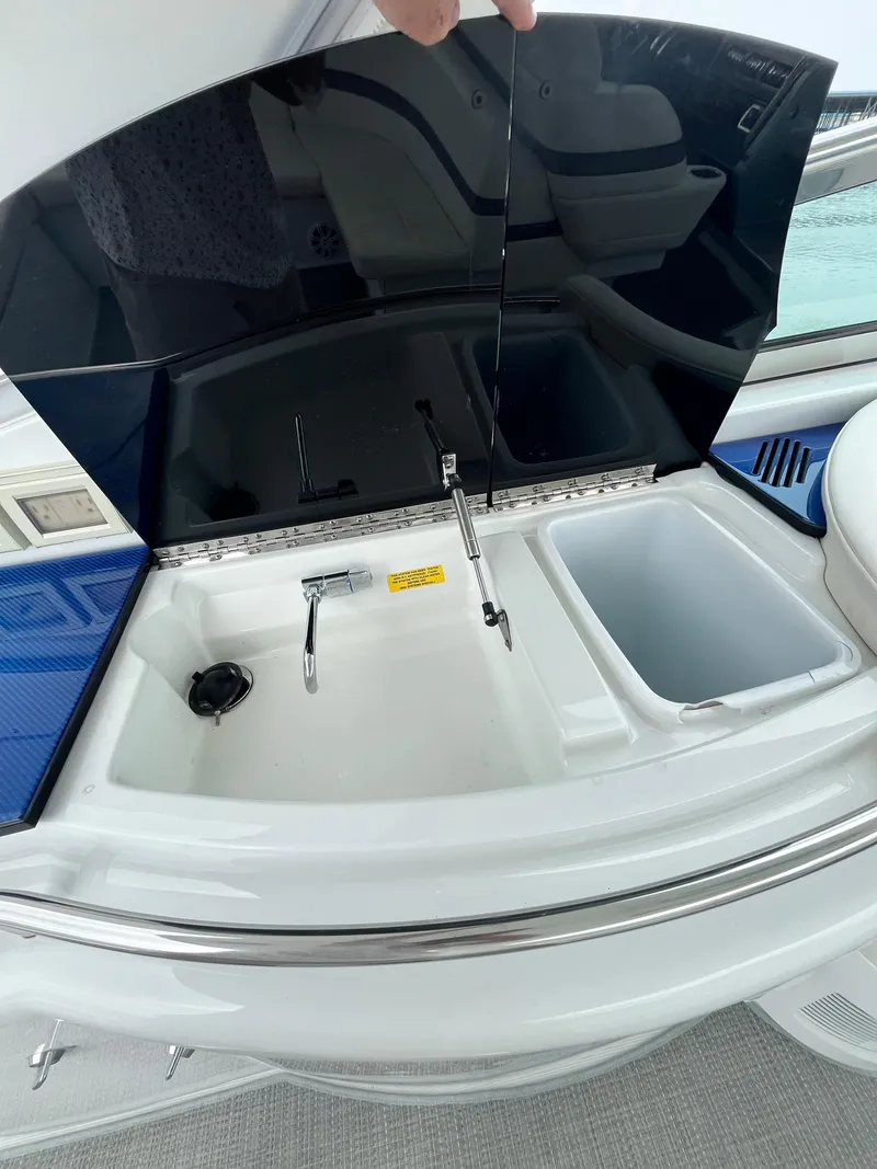 Slide: The Image of 2013 Formula 400 SS FX8 boat interior with open storage compartment. - 26
