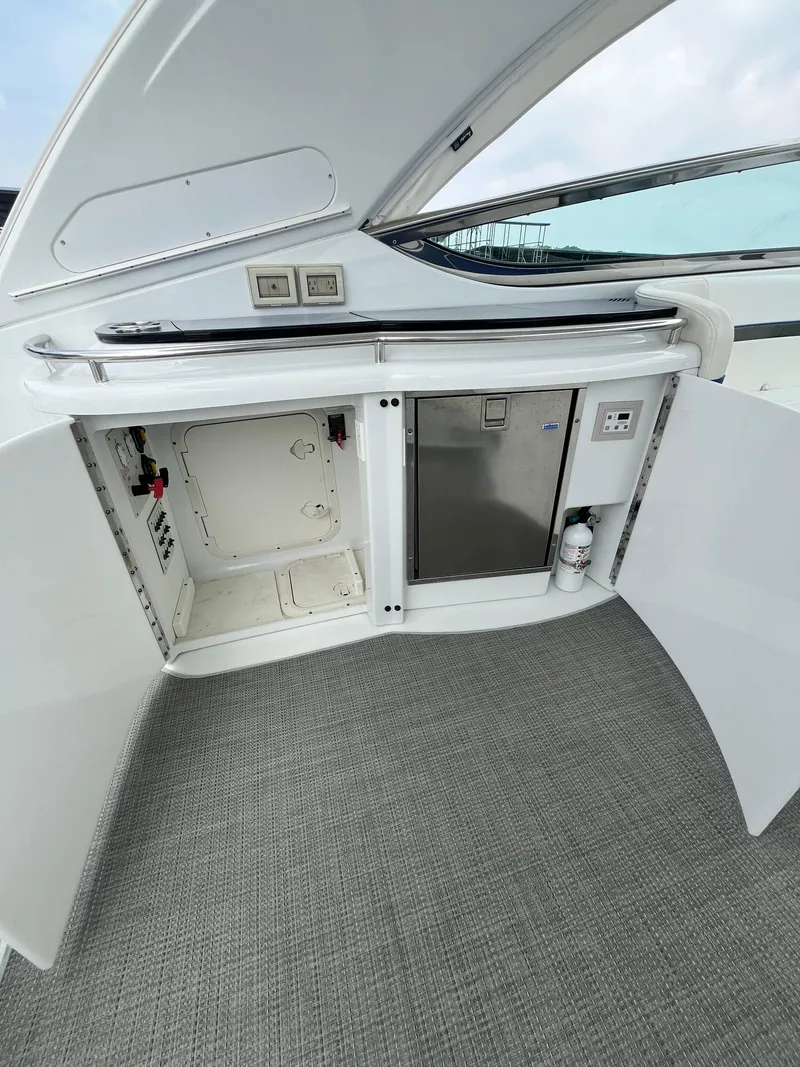 Slide: The Image of 2013 Formula 400 SS FX8 yacht interior with open storage compartments and sleek design. - 27
