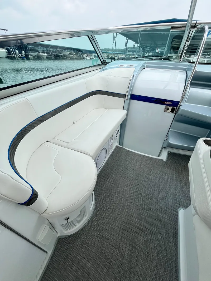 Slide: The Image of 2013 Formula 400 SS FX8 boat interior with white seating and gray carpet. - 29