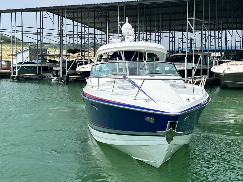 Slide: The Image of 2013 Formula 400 SS FX8 boat docked in marina. - 6