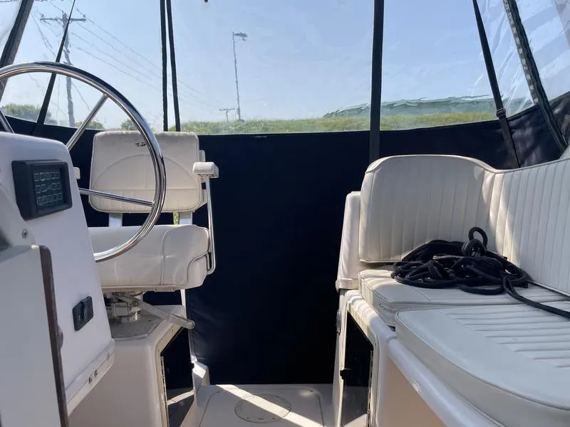 Slide: The Image of Interior of 1997 Grady-White 268 Islander boat with seating and steering wheel. - 11