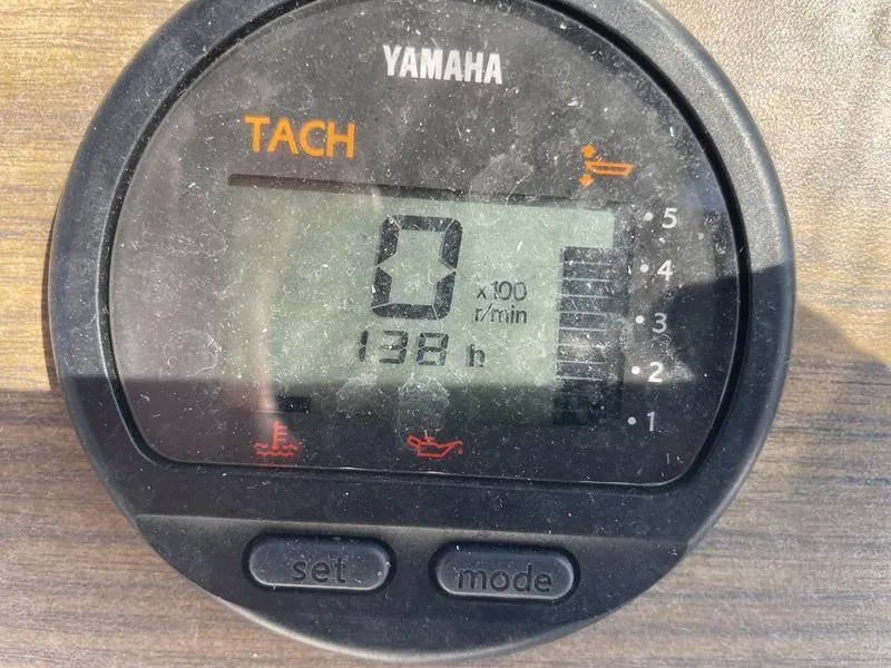 Slide: The Image of Yamaha tachometer displaying 138 hours on a 1997 Grady-White 268 Islander boat. - 4