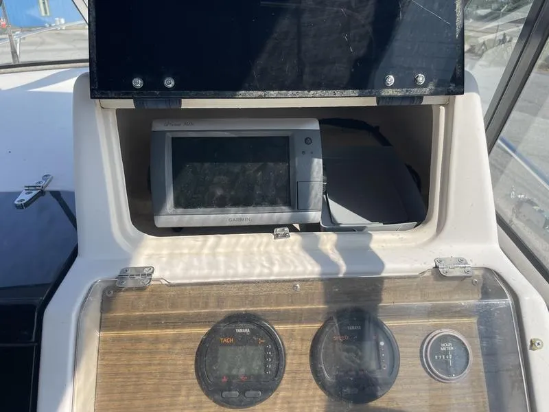 Slide: The Image of 1997 Grady-White 268 Islander boat dashboard with navigation equipment and gauges. - 5