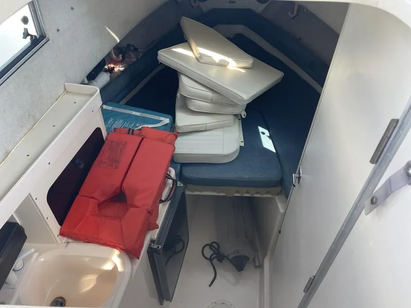Slide: The Image of 1997 Grady-White 268 Islander cabin interior with cushions and life jacket. - 6