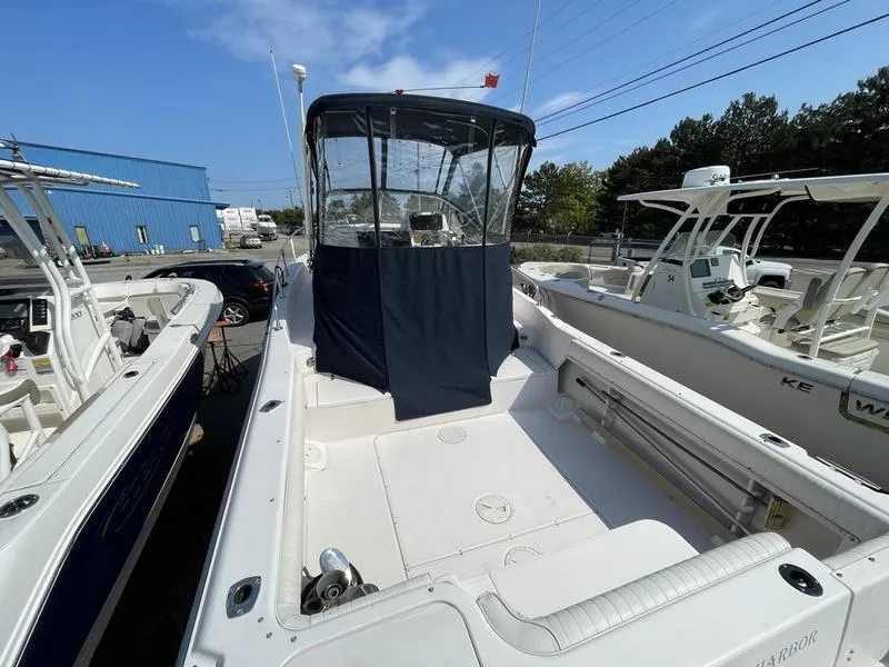 Slide: The Image of 1997 Grady-White 268 Islander boat with covered cockpit, docked outdoors. - 8