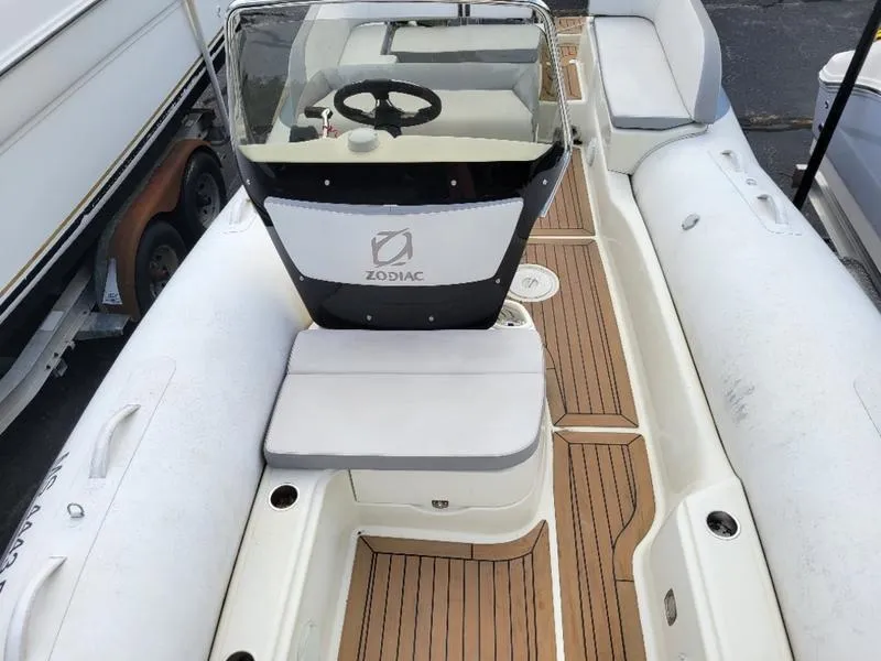 Slide: The Image of 2018 Zodiac NZO 22 boat interior with seating and steering console. - 16
