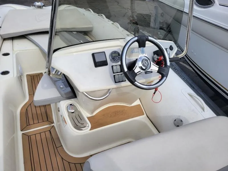 Slide: The Image of 2018 Zodiac NZO 22 boat interior with steering wheel and control panel. - 5