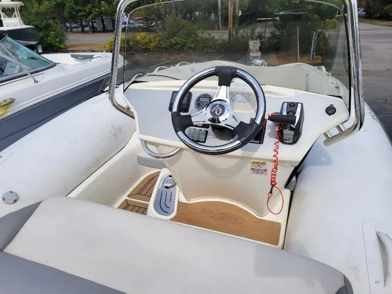 Slide: The Image of 2018 Zodiac NZO 22 boat cockpit with steering wheel and controls. - 7