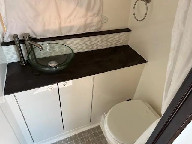 Slide: The Image of Modern bathroom in 2020 Sea Ray Sundancer 320 yacht with glass sink and toilet. - 5