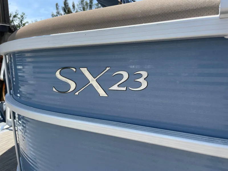 Slide: The Image of 2020 Bennington SX 23 SXSR pontoon boat, blue exterior detail. - 10