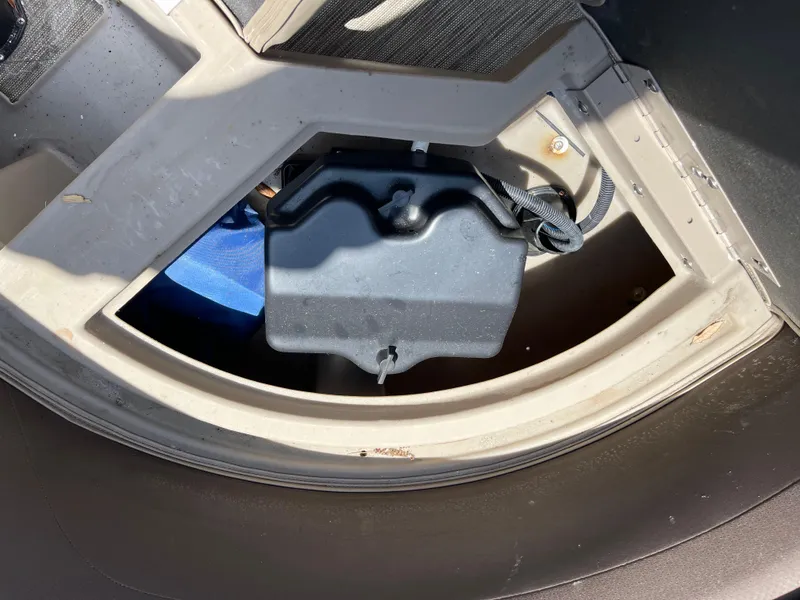 Slide: The Image of 2020 Bennington SX 23 SXSR boat storage compartment with black cover. - 19