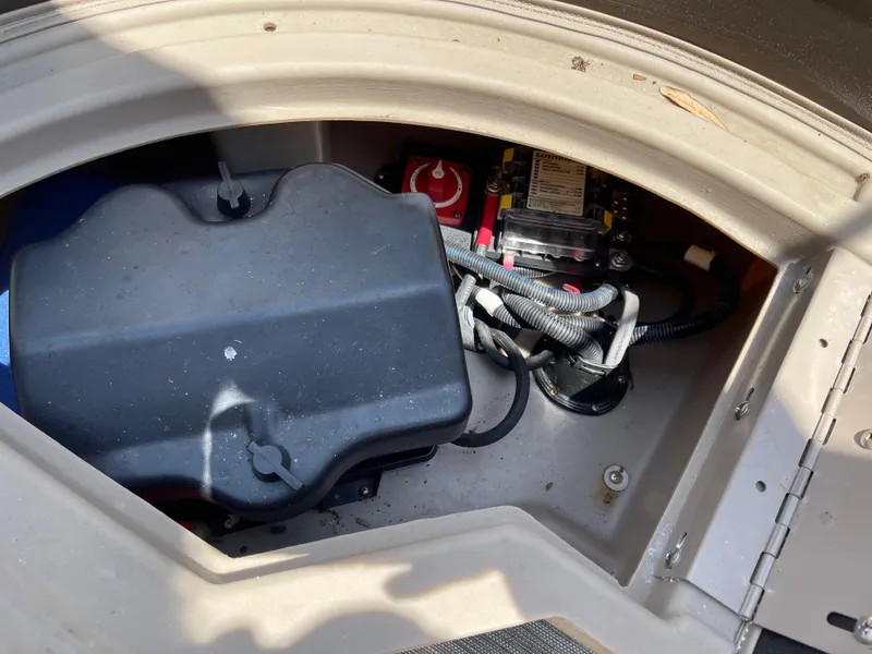Slide: The Image of 2020 Bennington SX 23 SXSR boat battery compartment with wiring and components. - 20