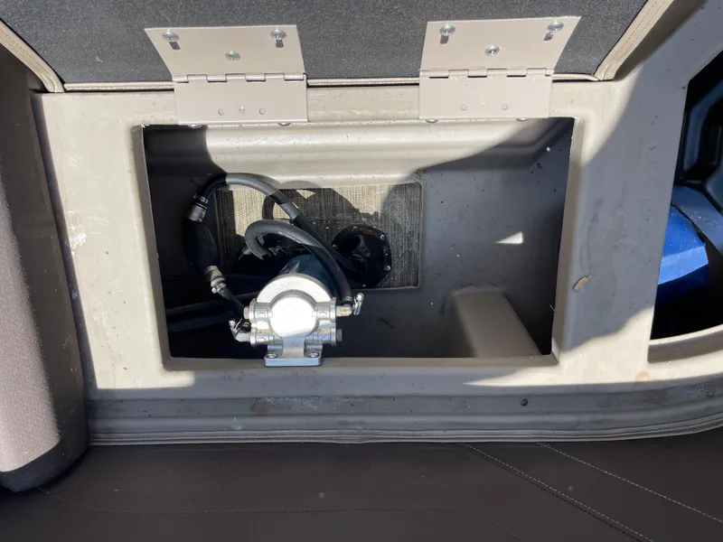 Slide: The Image of Storage compartment of 2020 Bennington SX 23 SXSR boat, showing internal components. - 21