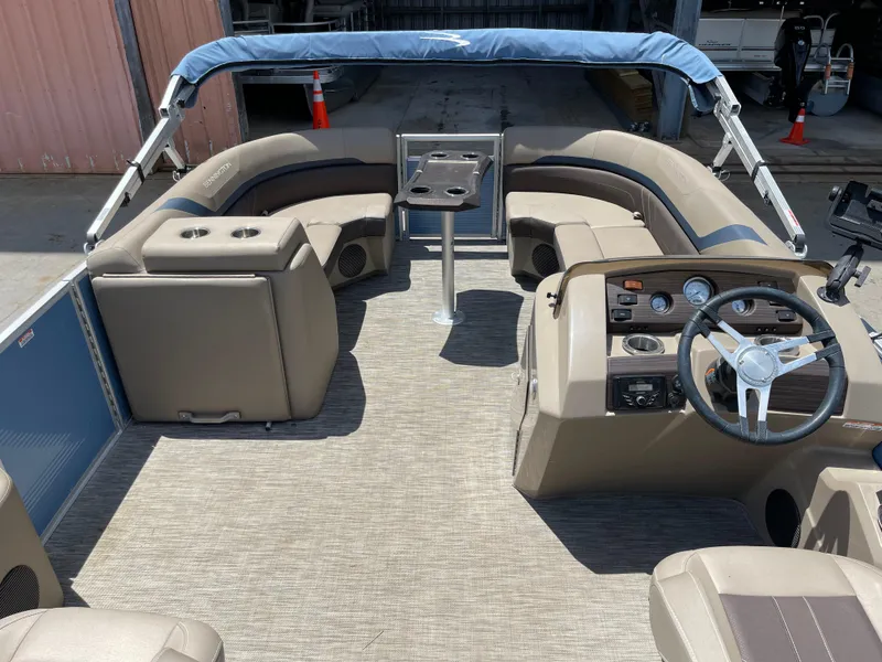 Slide: The Image of 2020 Bennington SX 23 SXSR pontoon boat interior with seating and steering console. - 24