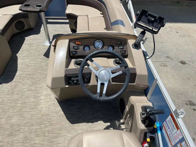 Slide: The Image of 2020 Bennington SX 23 SXSR boat interior with steering wheel and control panel. - 25