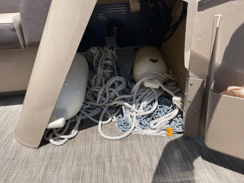 Slide: The Image of Storage compartment in 2020 Bennington SX 23 SXSR boat with ropes and fenders. - 30