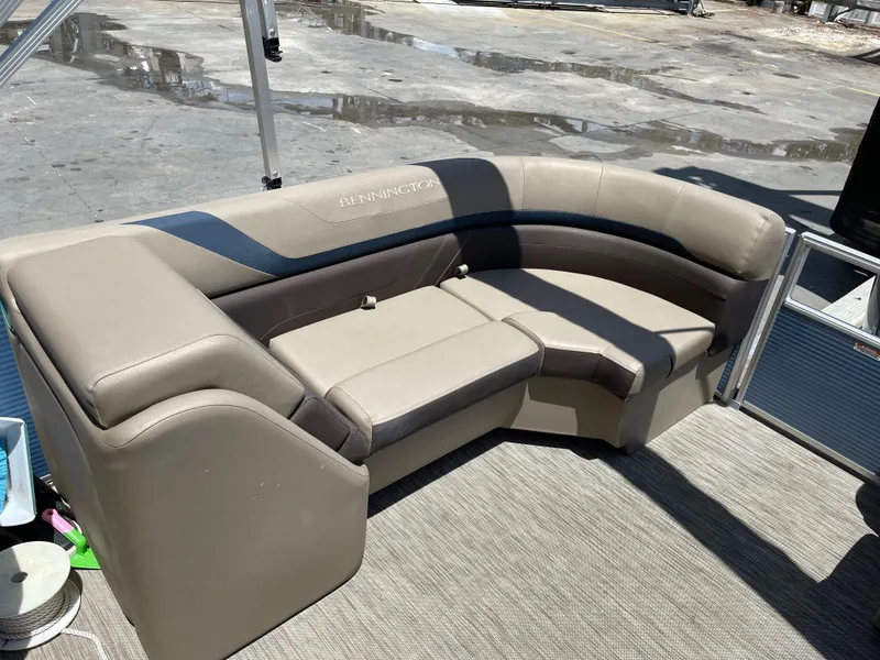 Slide: The Image of 2020 Bennington SX 23 SXSR boat seating, beige upholstery, outdoor setting. - 31