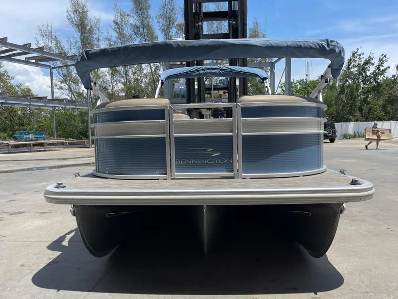 Slide: The Image of 2020 Bennington SX 23 SXSR pontoon boat, rear view, parked outdoors. - 5