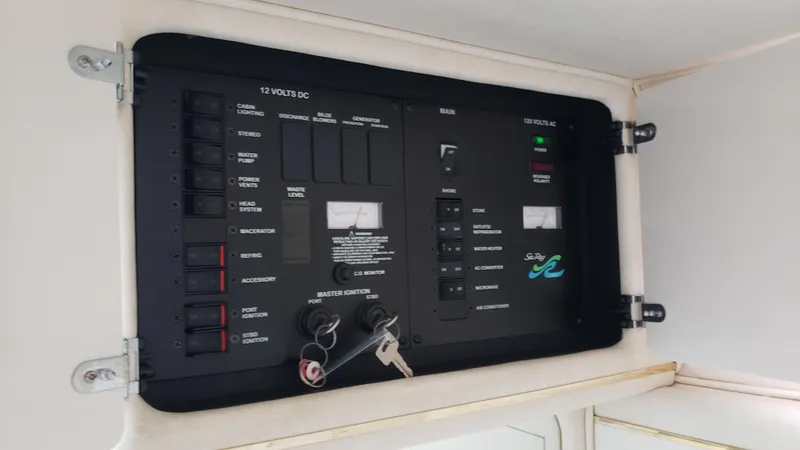 Slide: The Image of Electrical control panel on a 2000 Sea Ray 290 Sundancer boat. - 12