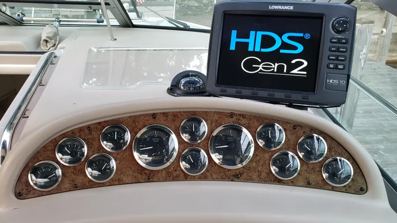 Slide: The Image of Dashboard of 2000 Sea Ray 290 Sundancer with Lowrance HDS Gen2 display and gauges. - 13