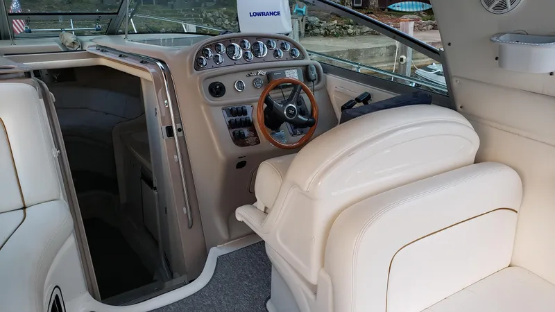 Slide: The Image of Interior of 2000 Sea Ray 290 Sundancer boat with steering wheel and control panel. - 20