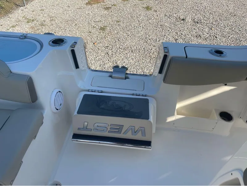 Slide: The Image of 2021 Key West 263FS boat interior with seating and storage compartments. - 12