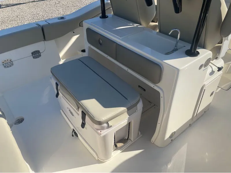 Slide: The Image of 2021 Key West 263FS boat interior with seating and storage area. - 24