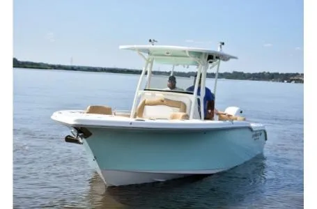 Slide: The Image of 2021 Key West 263FS boat cruising on calm waters. - 31