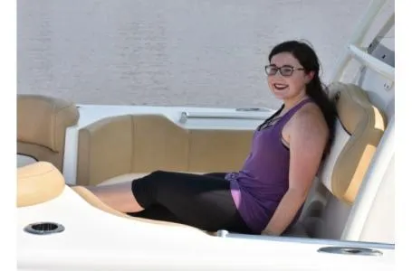 Slide: The Image of Woman relaxing on a 2021 Key West 263FS boat, enjoying the water. - 4