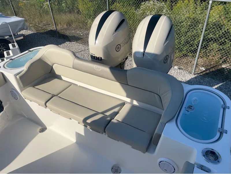 Slide: The Image of 2021 Key West 263FS boat interior with seating and dual Yamaha engines. - 42