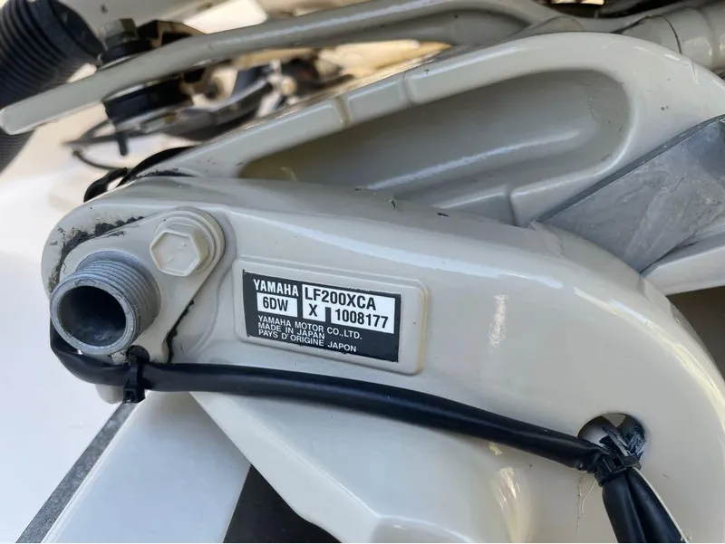 Slide: The Image of Close-up of Yamaha LF200XCA engine part on 2021 Key West 263FS boat. - 46