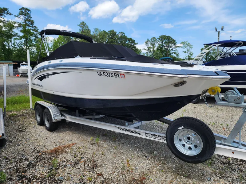 The Image of 2015 Chaparral 224 Sunesta boat on trailer, parked outdoors. - 0