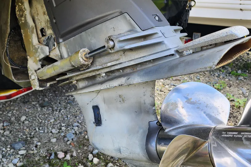 Slide: The Image of Close-up of 2015 Chaparral 224 Sunesta boat propeller and outdrive on gravel. - 5