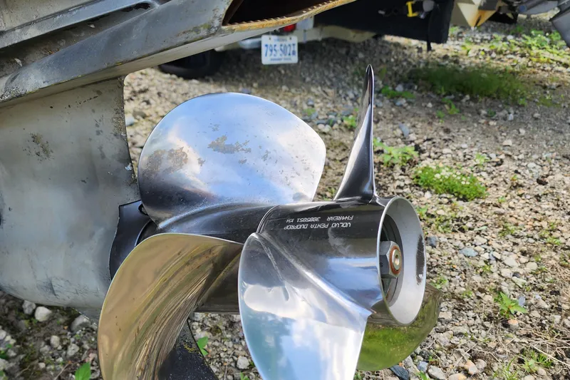 Slide: The Image of Close-up of a 2015 Chaparral 224 Sunesta boat propeller on gravel. - 6