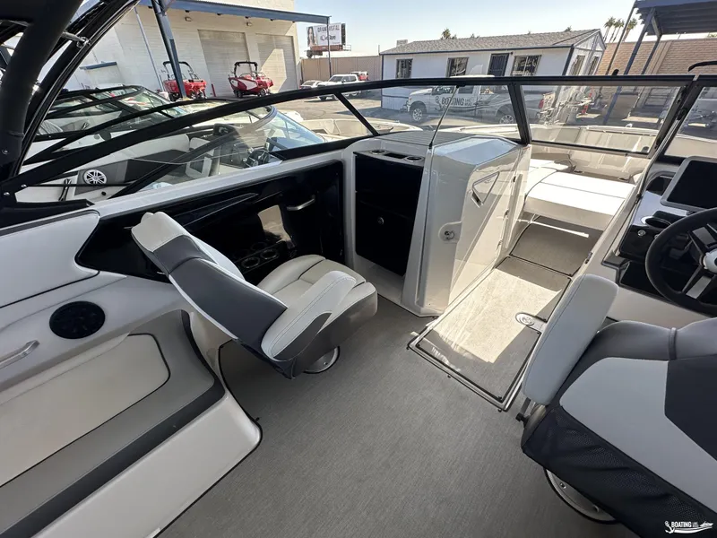 Slide: The Image of 2025 Yamaha Boats AR250 interior with modern seating and sleek design. - 7