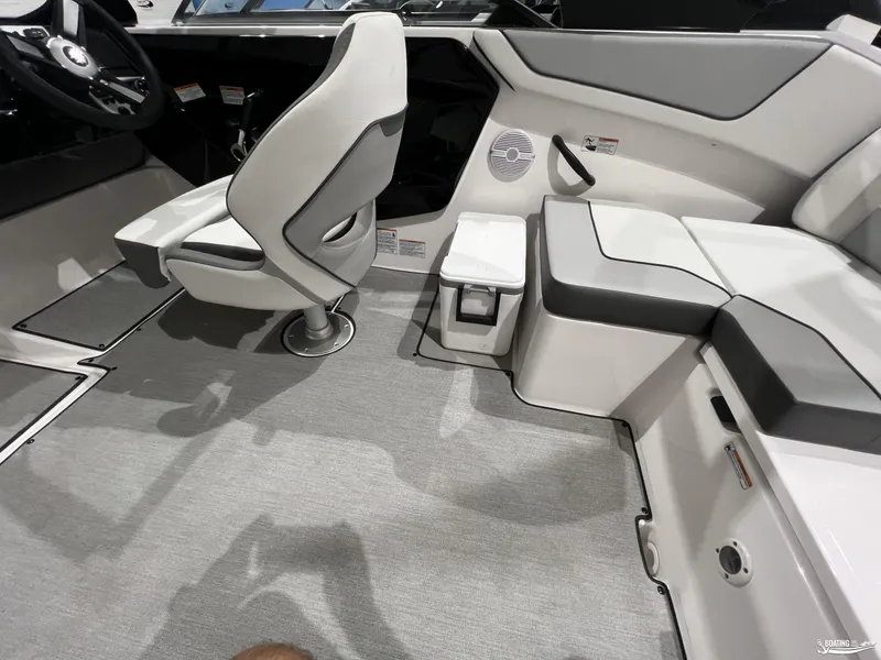 Slide: The Image of 2025 Yamaha Boats AR220 interior with modern seating and sleek design. - 10
