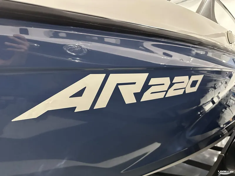 Slide: The Image of Close-up of 2025 Yamaha AR220 boat model name on blue hull. - 11