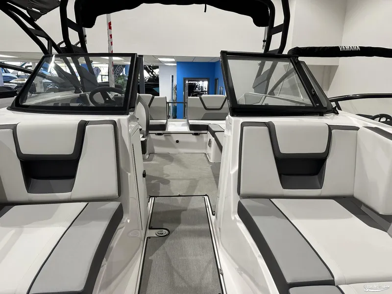 Slide: The Image of 2025 Yamaha Boats AR220 interior with sleek seating and modern design. - 12
