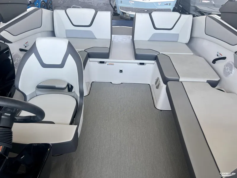 Slide: The Image of 2025 Yamaha Boats AR220 interior with modern seating and sleek design. - 2
