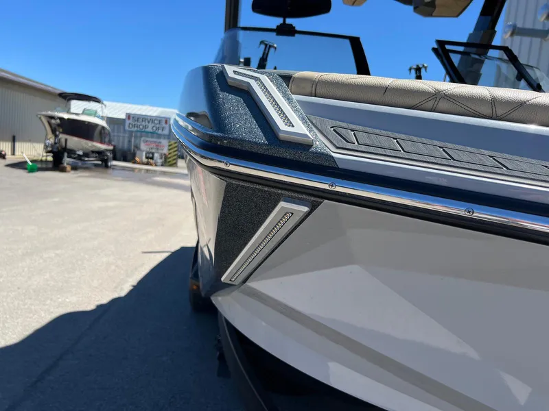 Slide: The Image of 2022 Nautique Super Air Nautique G23 Paragon boat, close-up view, parked outdoors. - 10
