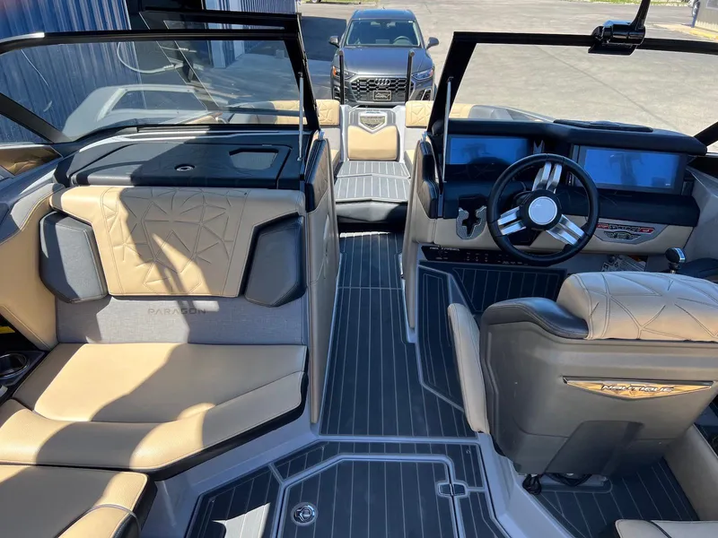 Slide: The Image of 2022 Nautique Super Air Nautique G23 Paragon interior with luxury seating and modern dashboard. - 17