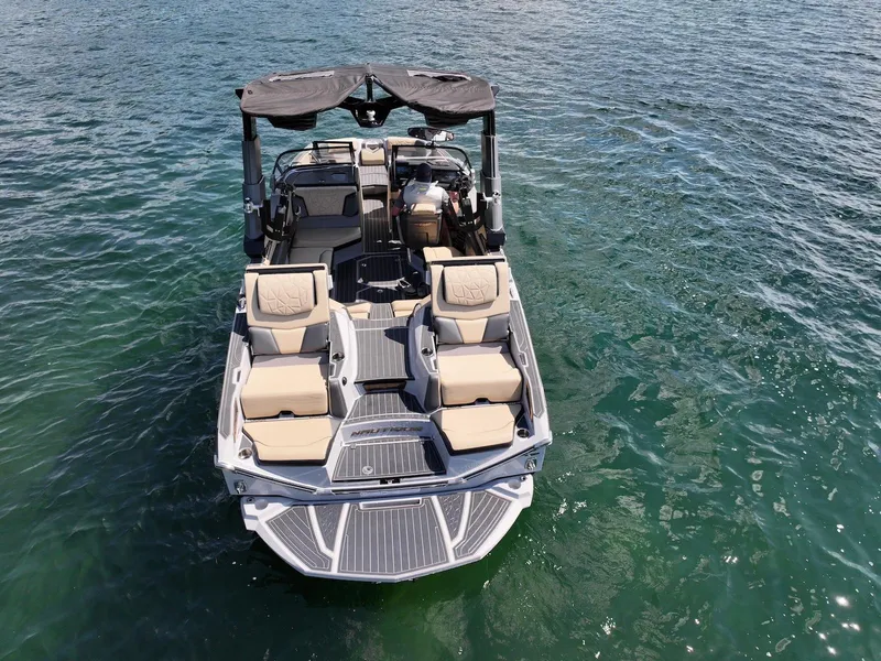 Slide: The Image of 2022 Nautique Super Air Nautique G23 Paragon on water, showcasing luxury seating and design. - 3